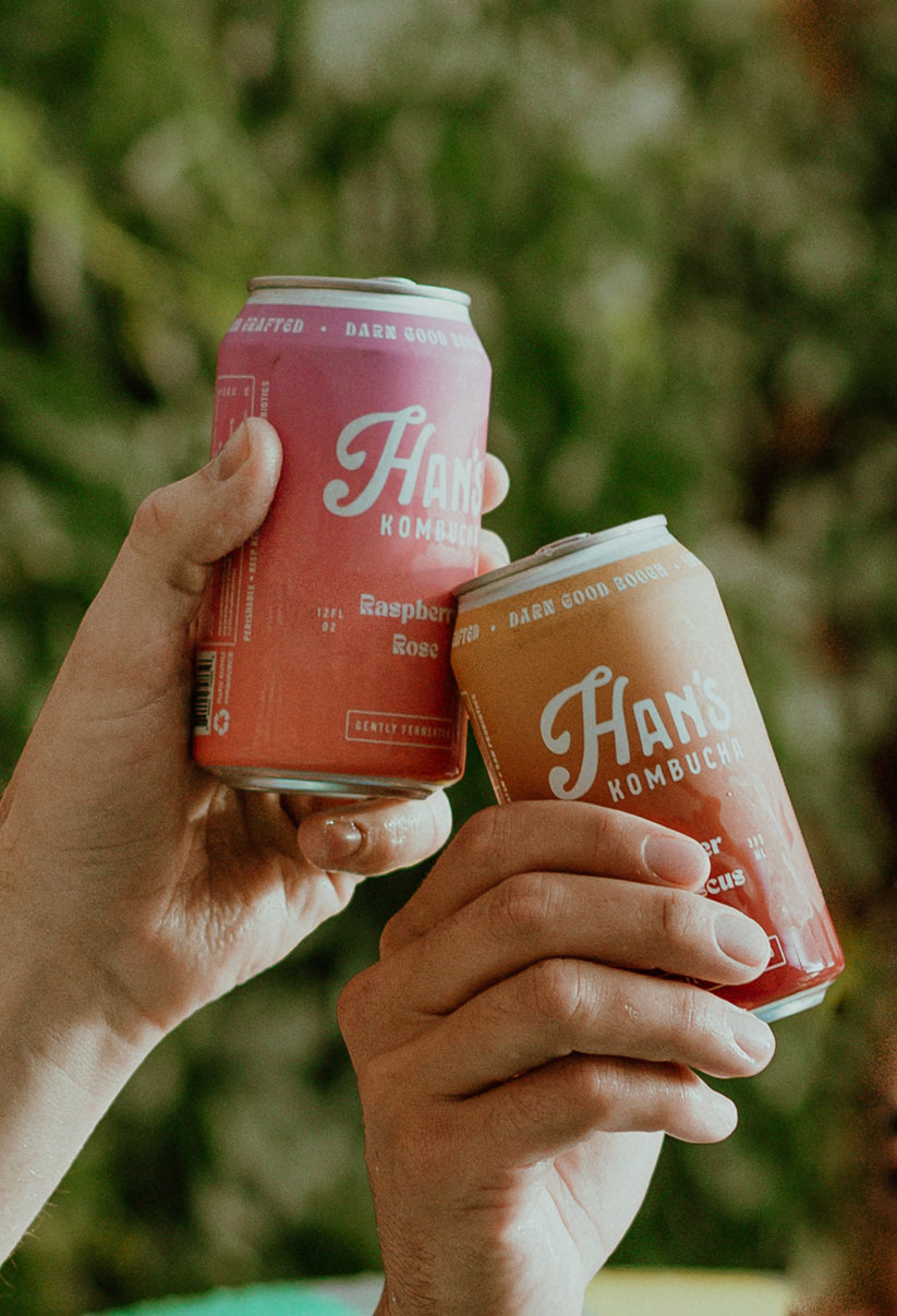 Han's Kombucha Cans in hands